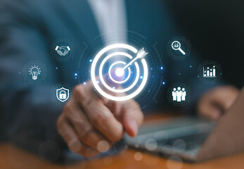 Businessman planning, businessman hand icon pointing digital target with technology marketing strategy, business goals, data analysis, customer success, teamwork and innovation concept.