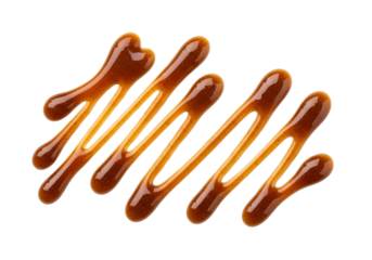 Caramel sauce drips in a zigzag pattern against a black background, showcasing a rich, amber hue.