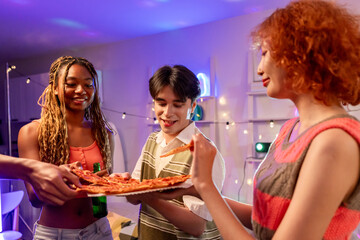 Group of diverse Generation Z friends enjoying a party in cozy house. 