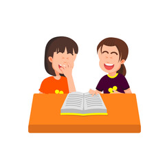 Two little girls laugh out loud while reading a book together at a desk