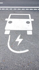 Electric vehicle parking sign on asphalt