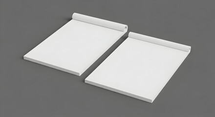 Two blank white notepads with spiral binding on a gray surface, ready for notes.