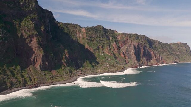 Aerial Drone Panning Out From Lush Green Coastal Cliffs At Rocha Do Navio, Santana, Madeira, Portugal.