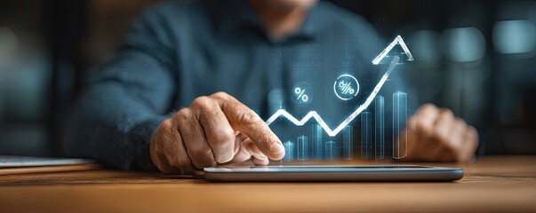 Person using a tablet with a projected upward trend graph