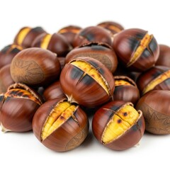 Pile of roasted chestnuts with cracked shells, isolated on white background