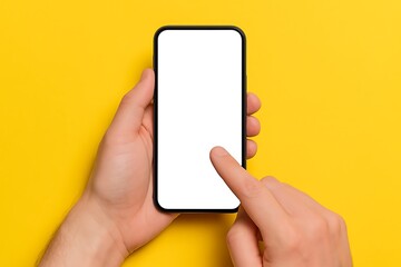 Person holding smartphone with blank white screen in hand against yellow background showing mockup application user interface template for mobile app design advertising and web development projects