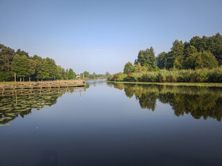 Cloudless landscape with a lake with space for inscriptions, quotes
