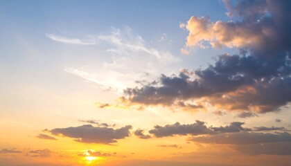 Fototapeta premium A breathtaking sunset sky, filled with soft, golden hues and fluffy clouds.