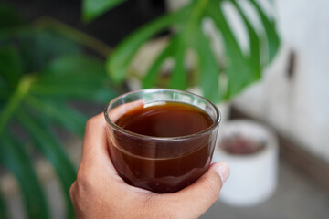 Arabica V60, captured on September 2, 2025. Hand-brewed Arabica coffee using V60 pour-over method, hot black coffee in glass server and ceramic cup, minimalist modern café style lifestyle photography