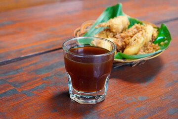 Arabica V60, captured on September 2, 2025. Hand-brewed Arabica coffee using V60 pour-over method, hot black coffee in glass server and ceramic cup, minimalist modern café style lifestyle photography