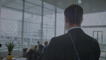 Animation of network of connections over diverse business people talking - Powered by Adobe