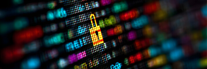 Fototapeta premium Close-up of a computer screen displaying colorful diital data with a focus on padlock icon, symbolizingcybersecurity