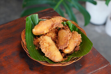 Indonesian Fried Banana, captured on September 2, 2025. Traditional snack of ripe banana coated in crispy golden batter, served on rustic plate, authentic homemade flavor