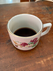cup of coffee on wooden table