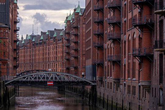 Hamburg Speicherstadt district with historic brick warehouses, canal and bridges, UNESCO World Heritage Site representing industrial architecture and urban heritage in Germany