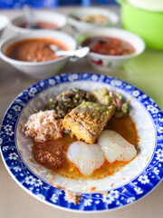 Indonesian traditional food. Indonesian comfort food: Papeda (sago starch) served with turmeric fish stew (Kuah Kuning). A traditional delicacy from Maluku and Papua.
