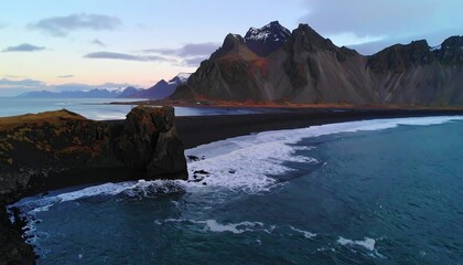 Dramatic Coastal Cliffs and Black Sand Beach at Dusk in Iceland