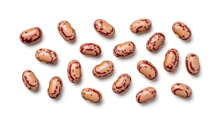 Obraz premium A scattered collection of pinto beans, showcasing their distinctive speckled brown and tan patterns against a clean white background.