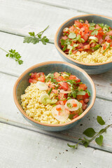 Millet salad with tomatoes and herbs