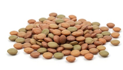 Close-up view of a pile of brown and green lentils on a white surface.
