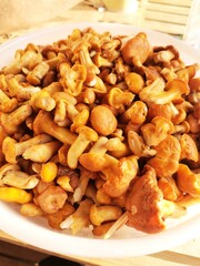 plate with yellow mushrooms on it