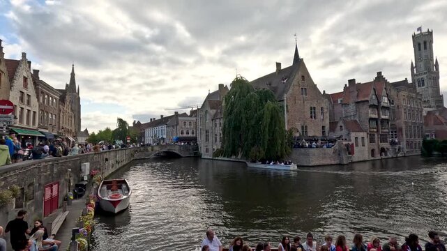 Tour Boat Glides Through Medieval Canal in Bruges
