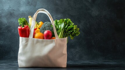 A canvas bag filled with fresh vegetables on a dark background.