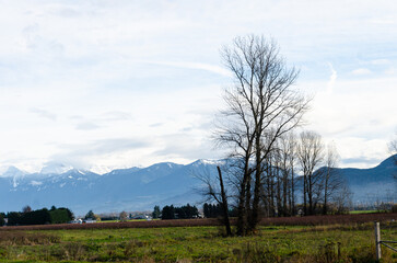 View of rural canada on Highway from Abbotsford to Hope,   BC, Canada with mountains, valleys and farms in the background