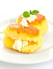 Two golden-brown cheese cakes with filling