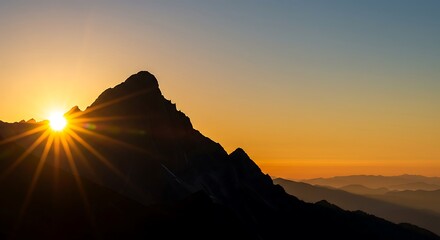 A stunning sunrise breaks over mountain peaks, symbolizing new beginnings, hope, and achieving goals. With copy space.