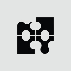 Four black puzzle pieces connected together in a square shape