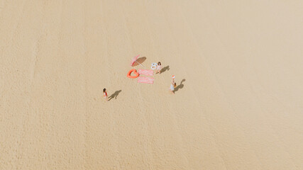 A group of people are on a beach, with a few of them holding umbrellas. The scene is peaceful and relaxing, with the sun shining down on the sand