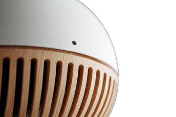 Close-up of a white spherical speaker with light brown wooden grill