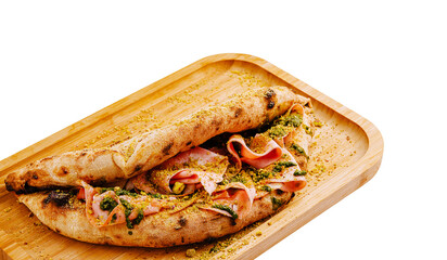 A freshly made calzone filled with ham and herbs rests on a wooden board. The golden crust has a crispy texture, showcasing artisanal craftsmanship. Perfect for a savory meal.