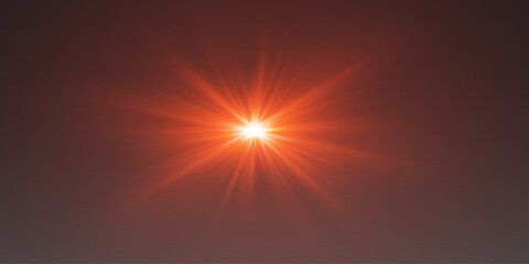 Obraz premium Bright red lens flare with glowing rays and optical glare on dark background
