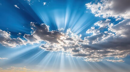Dramatic Sunbeams Through Gray And White Clouds In A Vibrant Blue Sky