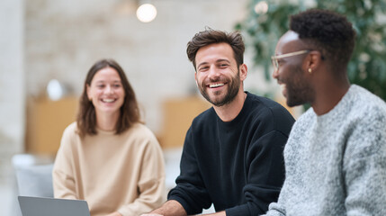 Smiling diverse team collaborating in a modern office space. Represents teamwork, innovation, and positive workplace environment. Ideal for corporate or educational use.