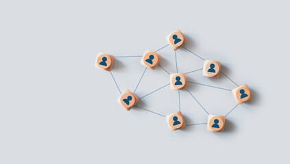 Organizational network structure with connected people icons on wooden blocks, showing team collaboration, stakeholder mapping, social graph, and business communication on a light background