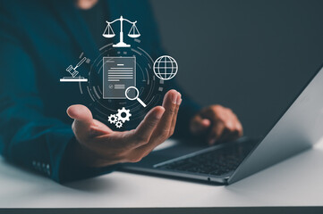 A person holds a hand out, displaying icons representing law, technology, and information, with a laptop in the background, suggesting a digital legal environment.