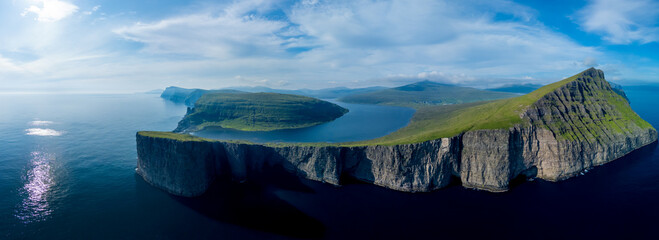 Dramatic coastal cliffs of Faroe Islands showcasing stunning natural beauty and tranquility