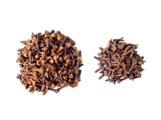 A pile of fresh dried brown cloves isolated on white background. Spice cloves. Close up of dried aromatic clove flower buds. Top view.