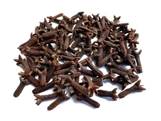 A pile of fresh dried brown cloves isolated on white background. Spice cloves. Close up of dried aromatic clove flower buds.