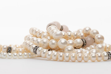 Bunch of white pearls glistening under light