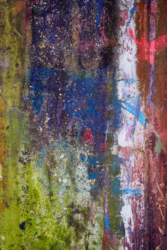 Layers of colorful paint, rust and grunge