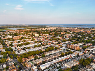 Tall buildings surrounded by lush trees in the cityscape
