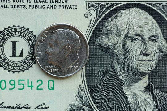 American cent coin on dollar bill close up. United States currency - Powered by Adobe