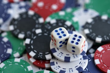 Dice game on the poker table in the casino. A successful combination of dice brought a lot of winning chips