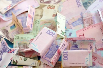 Big amount of different Ukrainian hryvnia money bills. Pile of crumpled ukrainian banknotes