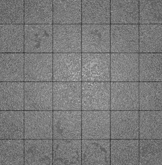Fototapeta premium Gray square tiles forming textured background pattern