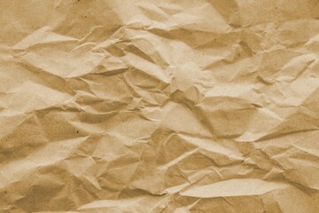 Fototapeta premium Brown crumpled recycled paper texture background. Kraft Paper